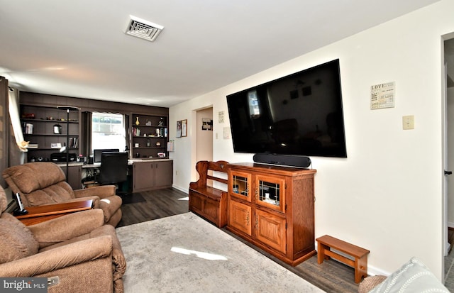 living room with dark hardwood / wood-style floors