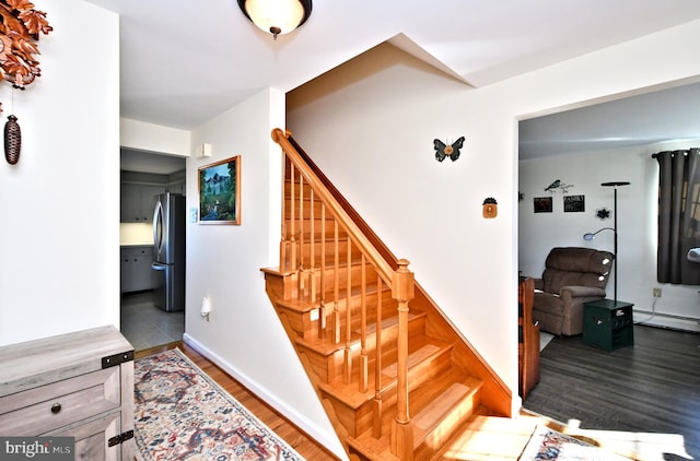 stairway featuring hardwood / wood-style floors