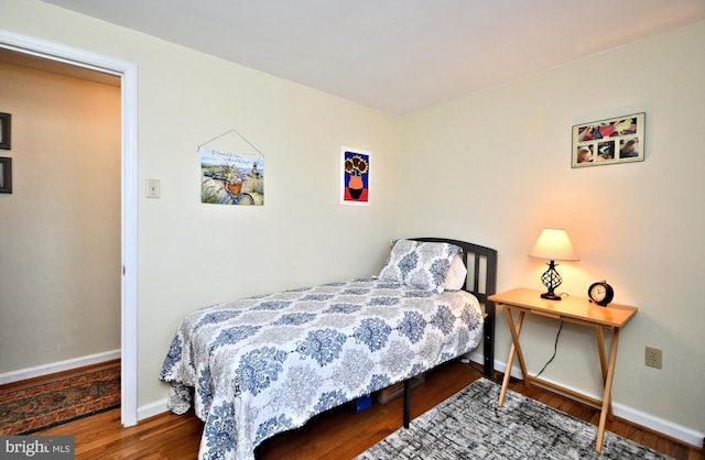 bedroom with wood-type flooring