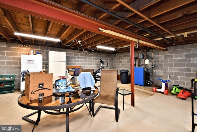 basement with white fridge