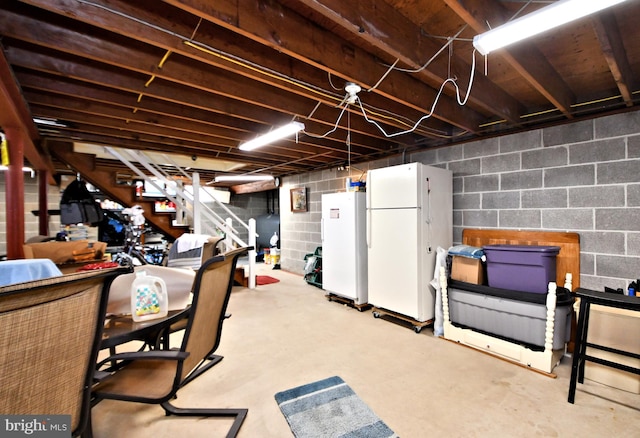 basement featuring white refrigerator