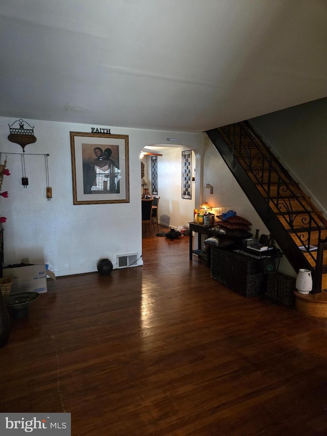 living room with dark hardwood / wood-style floors