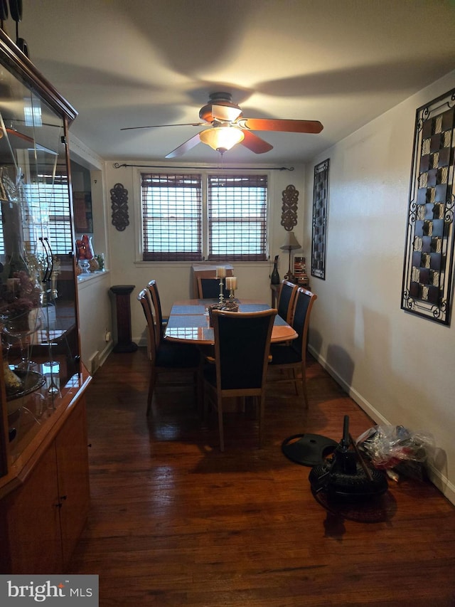 dining room featuring ceiling fan and dark hardwood / wood-style flooring