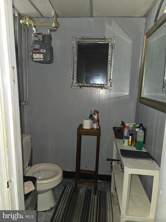 bathroom with tile patterned flooring and toilet