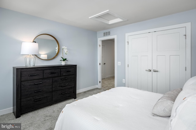 bedroom with light colored carpet and a closet