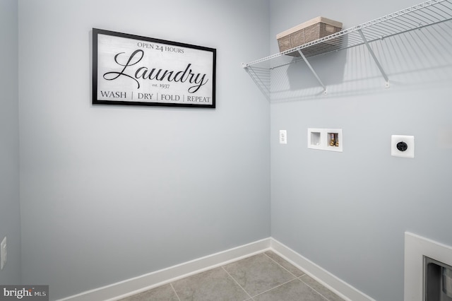 washroom featuring electric dryer hookup, light tile patterned floors, and hookup for a washing machine