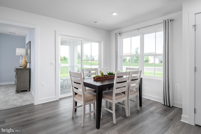 dining area with dark wood-type flooring