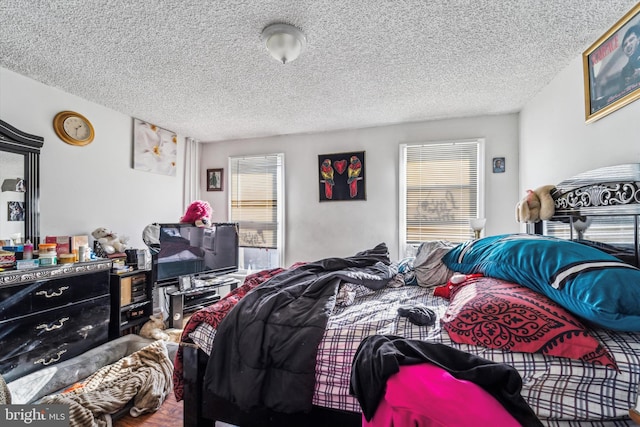 bedroom featuring a textured ceiling