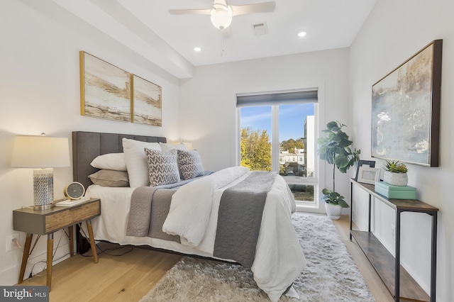 bedroom featuring ceiling fan and light hardwood / wood-style flooring