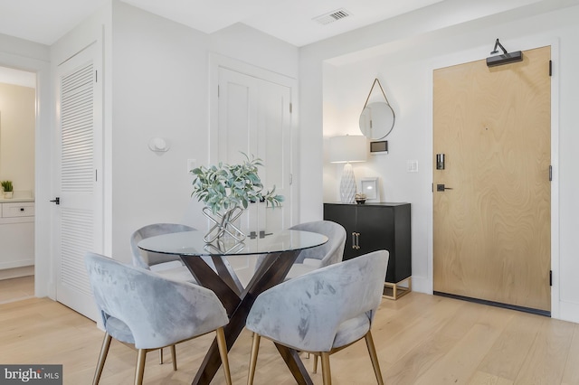 dining space featuring light hardwood / wood-style flooring