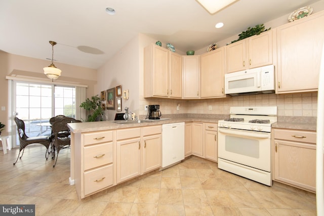 kitchen featuring sink, tasteful backsplash, kitchen peninsula, pendant lighting, and white appliances