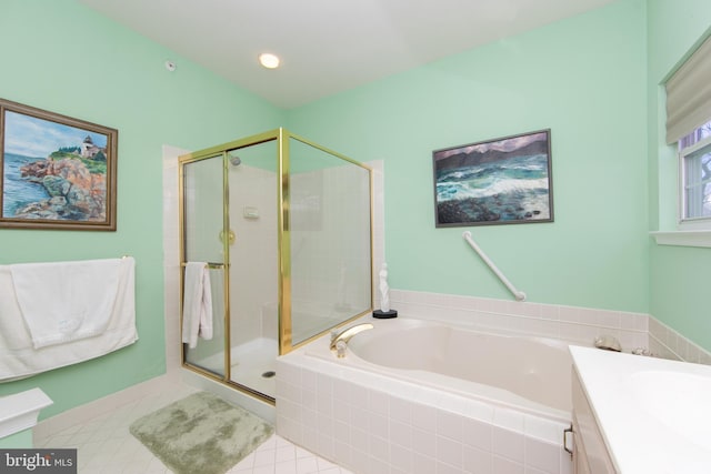 bathroom with tile patterned flooring, vanity, and separate shower and tub