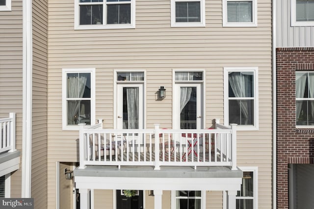 rear view of house with a balcony