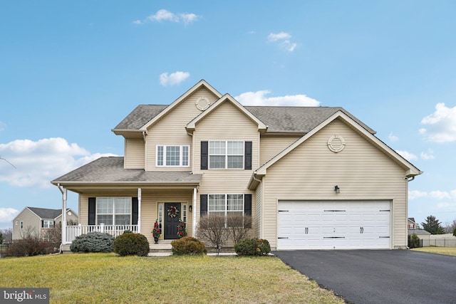 front facade featuring a porch, a garage, and a front lawn