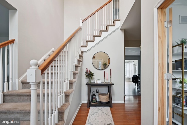 staircase featuring hardwood / wood-style flooring