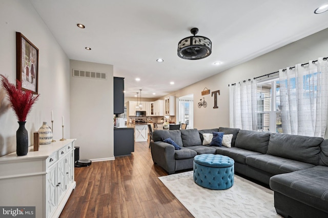 living room with dark hardwood / wood-style floors