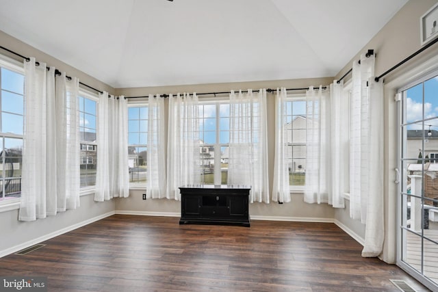 unfurnished sunroom featuring lofted ceiling