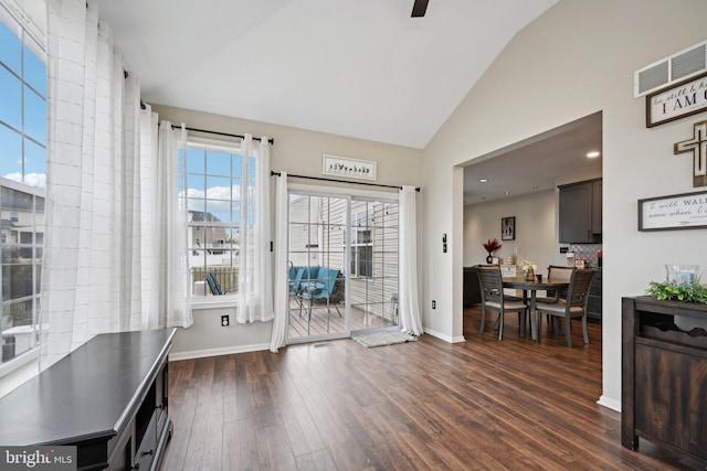 interior space featuring ceiling fan, dark hardwood / wood-style flooring, and lofted ceiling