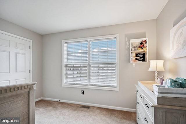 bedroom featuring light colored carpet