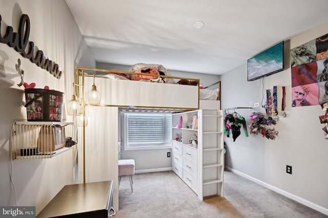 bedroom featuring light colored carpet