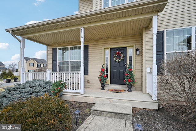 property entrance featuring covered porch