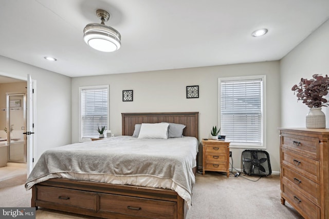 carpeted bedroom with ensuite bath