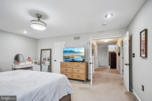 bedroom featuring light colored carpet