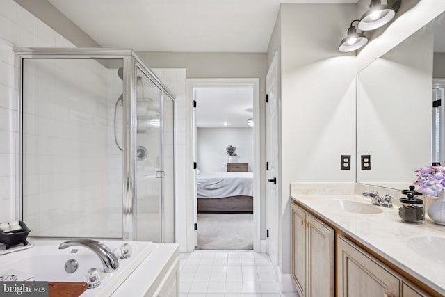 bathroom with tile patterned flooring, vanity, and independent shower and bath