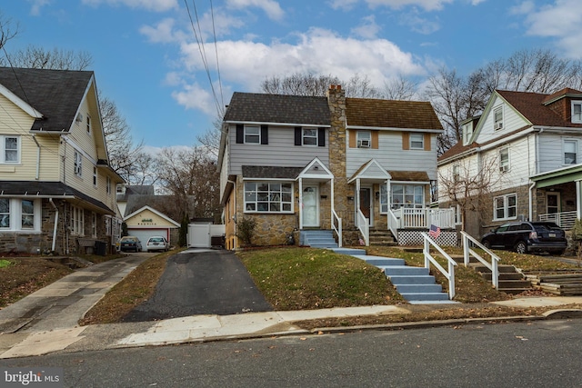 view of front of house with an outbuilding and a garage