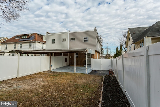 rear view of property featuring a patio