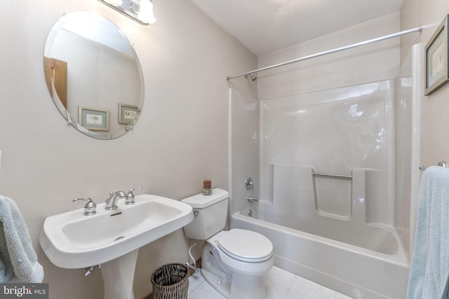 full bathroom with tile patterned flooring, toilet, shower / bathtub combination, and sink