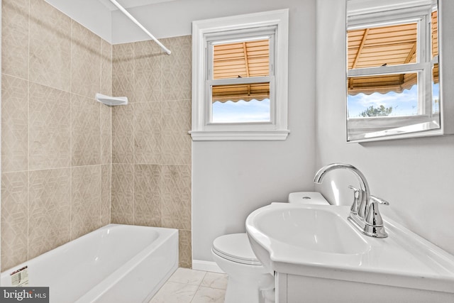 bathroom featuring toilet, plenty of natural light, and shower / bathtub combination