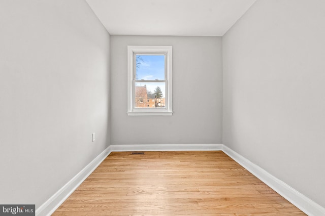 spare room with light hardwood / wood-style flooring