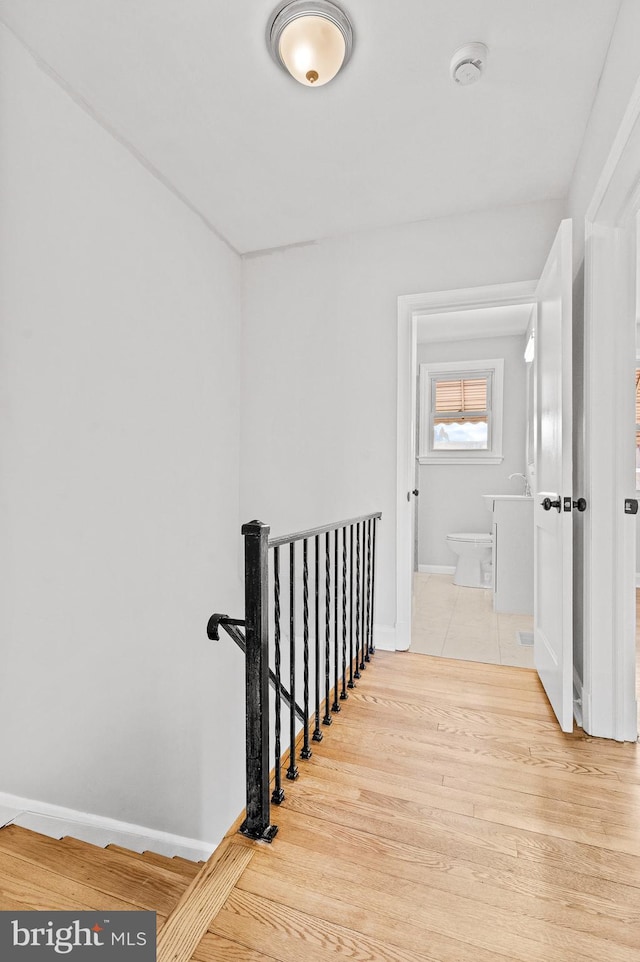 corridor featuring light hardwood / wood-style flooring