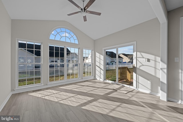 unfurnished sunroom with ceiling fan and lofted ceiling