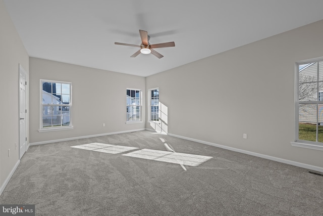 carpeted empty room with ceiling fan