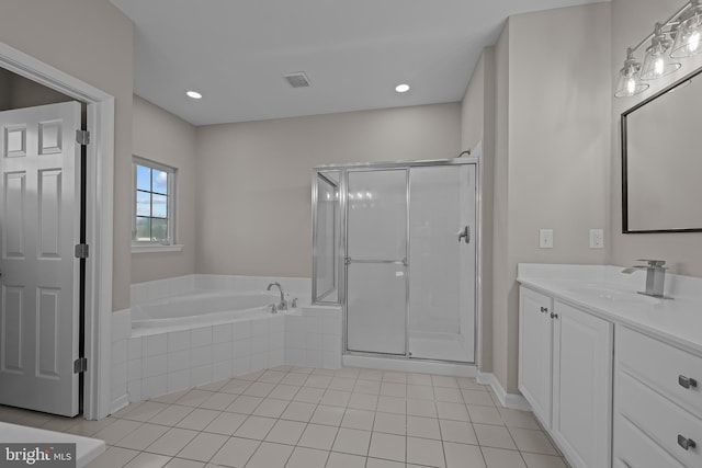 bathroom with tile patterned floors, plus walk in shower, and vanity