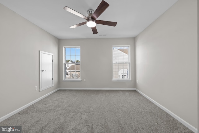 unfurnished room featuring ceiling fan and carpet floors