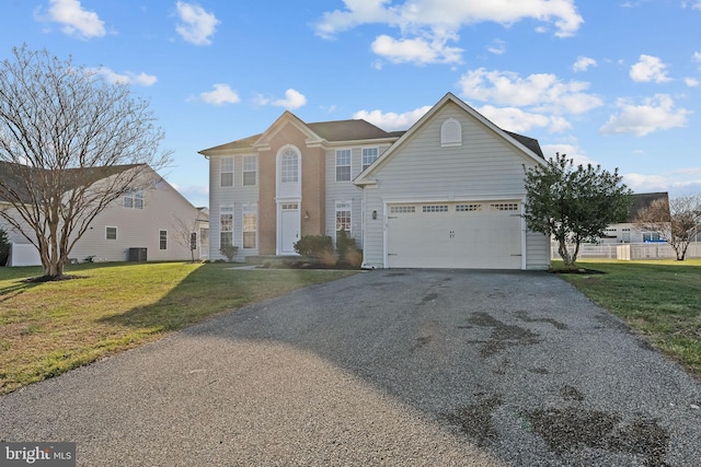 front facade with a front lawn and a garage