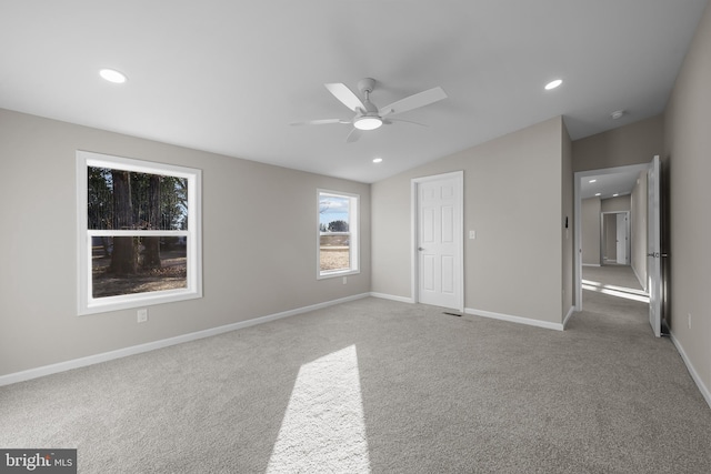 unfurnished bedroom with carpet, ceiling fan, and lofted ceiling