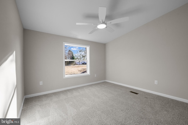 empty room with carpet flooring and ceiling fan