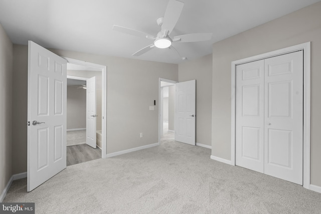 unfurnished bedroom with ceiling fan, a closet, and light carpet