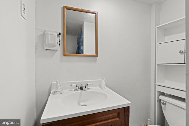 bathroom with vanity and toilet