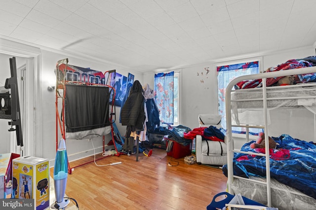 bedroom with wood-type flooring