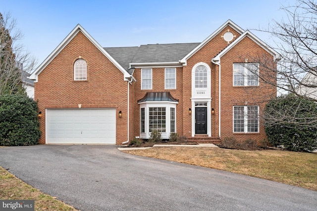 front facade with a garage