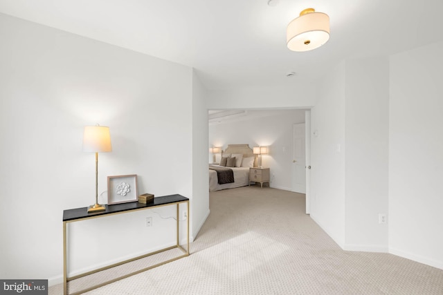 hallway with light colored carpet