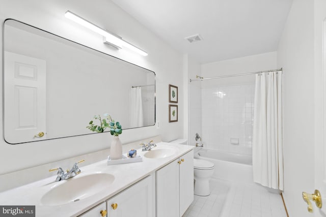 full bathroom featuring toilet, shower / bath combination with curtain, tile patterned flooring, and vanity