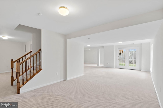 unfurnished room with light colored carpet