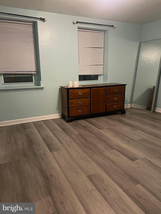 bedroom with hardwood / wood-style floors