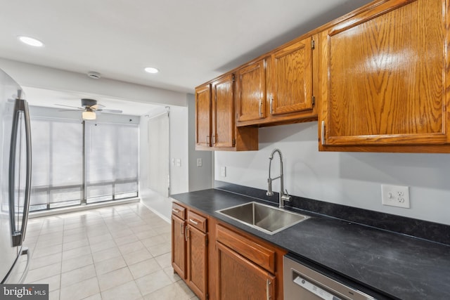 kitchen with ceiling fan, light tile patterned flooring, sink, and appliances with stainless steel finishes